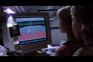 People in 1993 looking at a computer screen, where the file system is presented as a red box with blue boxes on top and connected to other red boxes by green lines.