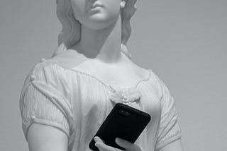 A marble statue of a woman holding a smartphone.