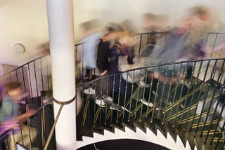 People walkig up on a staircase