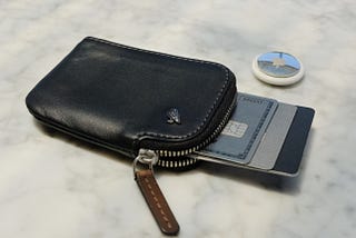 Black Bellroy Card Pocket with cards sticking out