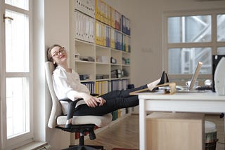 Woman sleeping at writing desk