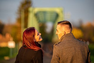 A young couple laughing, in love.