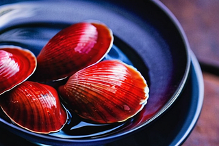 AI Generated Purple Bowl of Crimson Clams in Water