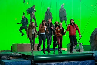 The cast of The Bubble running on a treadmill in front of a green screen