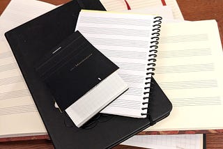Music practice notebooks of varying types and sizes