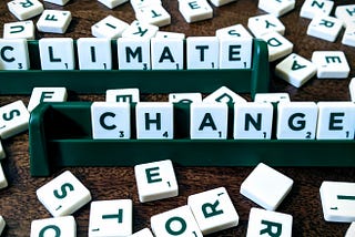 Scrabble letters arranged to form the phrase “climate change”