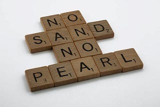No sand. No pearl. — stacked as words underneath each other-made of Scrabble tiles