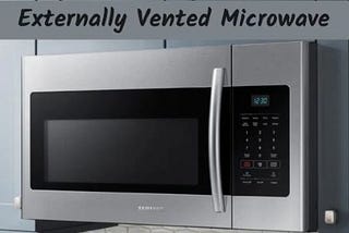 An externally vented microwave installed at the top of kitchen cabinet.