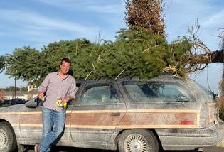Steve Harbaugh in front of the station wagon he parks in front of George’s House, an homage to National Lampoons Christmas Vacation