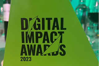 Digital Impact Awards 2023 — Gold Best Digital Accessibility: The trophy is green and in a triangular shape.