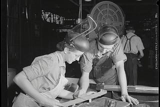 Factory workers at Vultee’s Nashville Division checking A-31 “Vengeance” dive bomber part to blueprint, February 1943. Photo credit: Alfred T. Palmer, Farm Security Administration — Office of War Information Photograph Collection (Library of Congress)