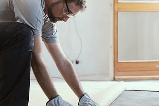 A contractor installing a new floor