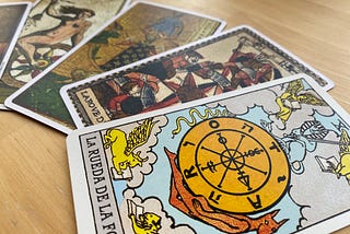 Versions by different authors and eras of the Wheel of Fortune tarot card.