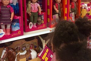 Why are all the white dolls sitting together on the Target shelf?