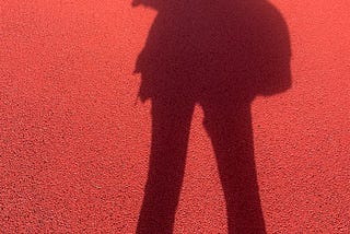 Author’s shadow on a red wall