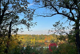 A view of the Mississippi River on a glassy September morning. You can see the leaves starting to change.