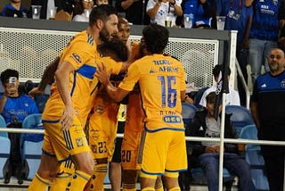 Tigres players celebrate their decisive goal of the match