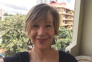 A photo of the author in 2016 on an apartment terrace in Phnom Penh, Cambodia