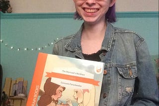 Ferschweiler holding her first self-published children’s book.
