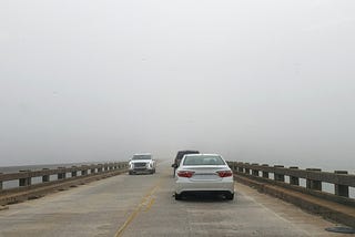 Fog on a bridge obscures the destination.