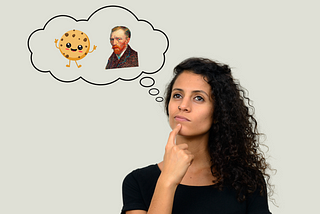 A woman with curly hair looking thoughtful, with a finger on her cheek and looking upwards. She is imagining a cartoonish cookie character alongside a portrait of Vincent Van Gogh, all contained within a thought bubble.