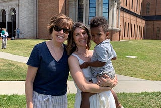 Author’s family photo shows two women smiling, with one holding a young child.