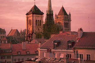 The towers of Geneva’s St. Pierre Cathedral seen across some rooftops