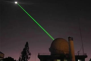 Will a laser pointer be visible on the Moon if directed toward it?