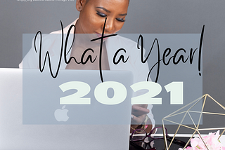 Tolu Amadi, the founder of  Aceit Digital on a desk with her laptop and phone recounting the year 2021