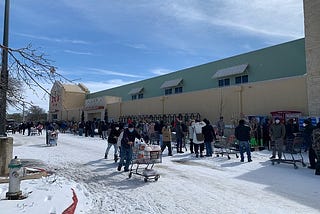 Texans line up outside a grocery store during the winter storm that knocked power offline.