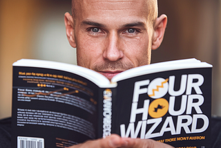Tim Ferris — look-a-like reading a fake book titled “Four Hour Wizard.” — Tim Ferris Shared His Weirdest Writing Hack