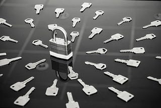 A lock surrounded by many keys
