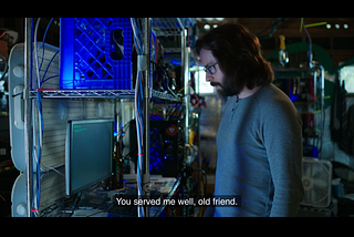 The Gilfoyle character from the HBO series staring at a computer monitor in a homespun ‘datacentre’ (actually running in a garage)