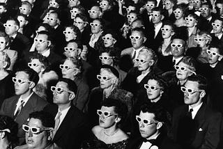Classic photo of audience members wearing 3D glasses during the first screening of “Bwana Devil,” the first full-length, color 3D movie, November 26, 1952, at the Paramount Theater in Hollywood.