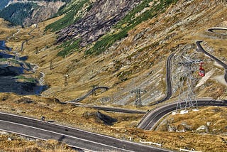 The Transfagarasan road in Romania has many tight curves & winds up a mountain. It gives stunning views & a challenging drive