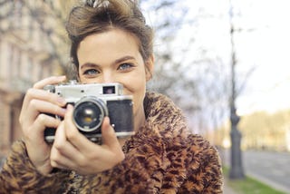 woman leopard jacket camera love