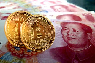 Two bitcoins rested on Yuan, China’s currency