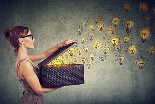 Woman opening basket and ideas that look like light bulbs are coming out