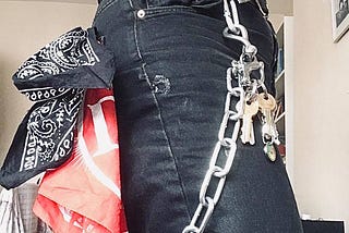 Various aspects of flagging, big chain, ring of keys, lezbag, red and black hankies, leather belt, lezbag, patched jeans