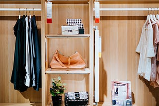 Clothing and accessories organized in a closet