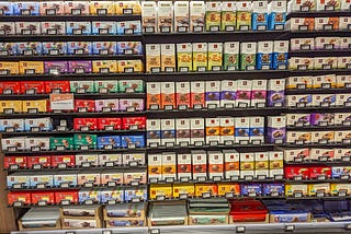 Store shelves showing hundreds of colorful bars of chocolate