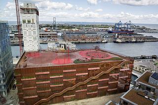 Parking garage in Denmark with a playground on top.