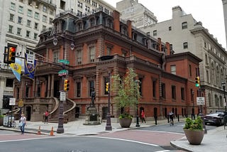 A stately, red building, home to the Union League of Philadelphia, Pennsylvania