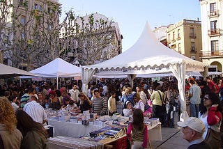 Temporary stalls selling books in a town square in Mataró, Catalonia, for World Book Day