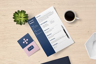 an image of a well-formatted resume on a table, next to a cup of coffee.