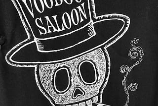 Skull with words “Voodoo Saloon” written across it. The saloon’s tagline: Serving spirits since 1948.