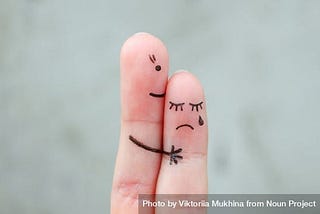 Two fingers together drawn together by marker as a comforting hug.