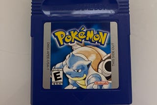 A copy of Pokemon Blue for the Game Boy.