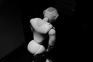 A black and white photo of a robot’s back