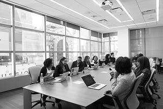 Team working together at a conference table.